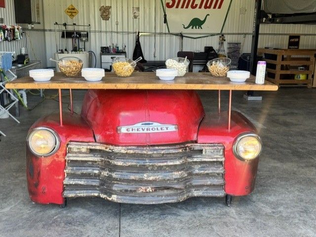 Vintage Chevrolet truck snack bar with popcorn and candy bowls