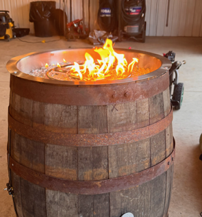 Whiskey barrel converted into a lit fire pit